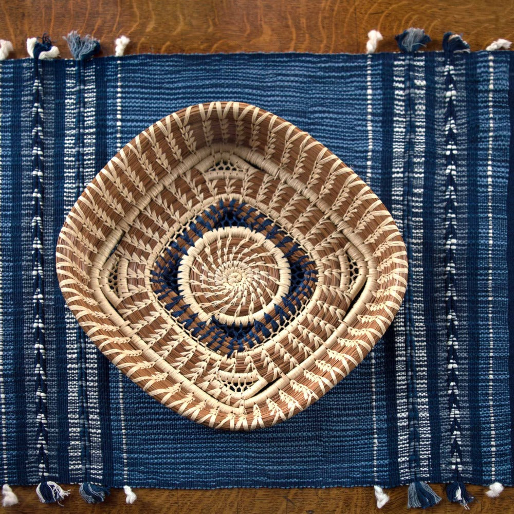 Handwoven table runner with an indigo arrow pattern woven on a backstrap loom