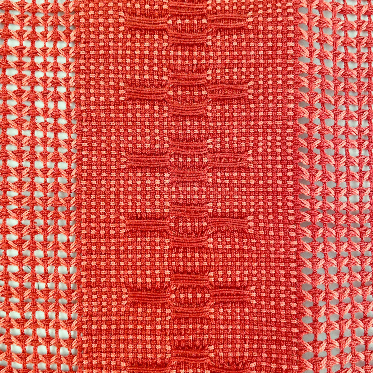 Terracotta table runner with a Calado cutwork pattern, a table dressing essential